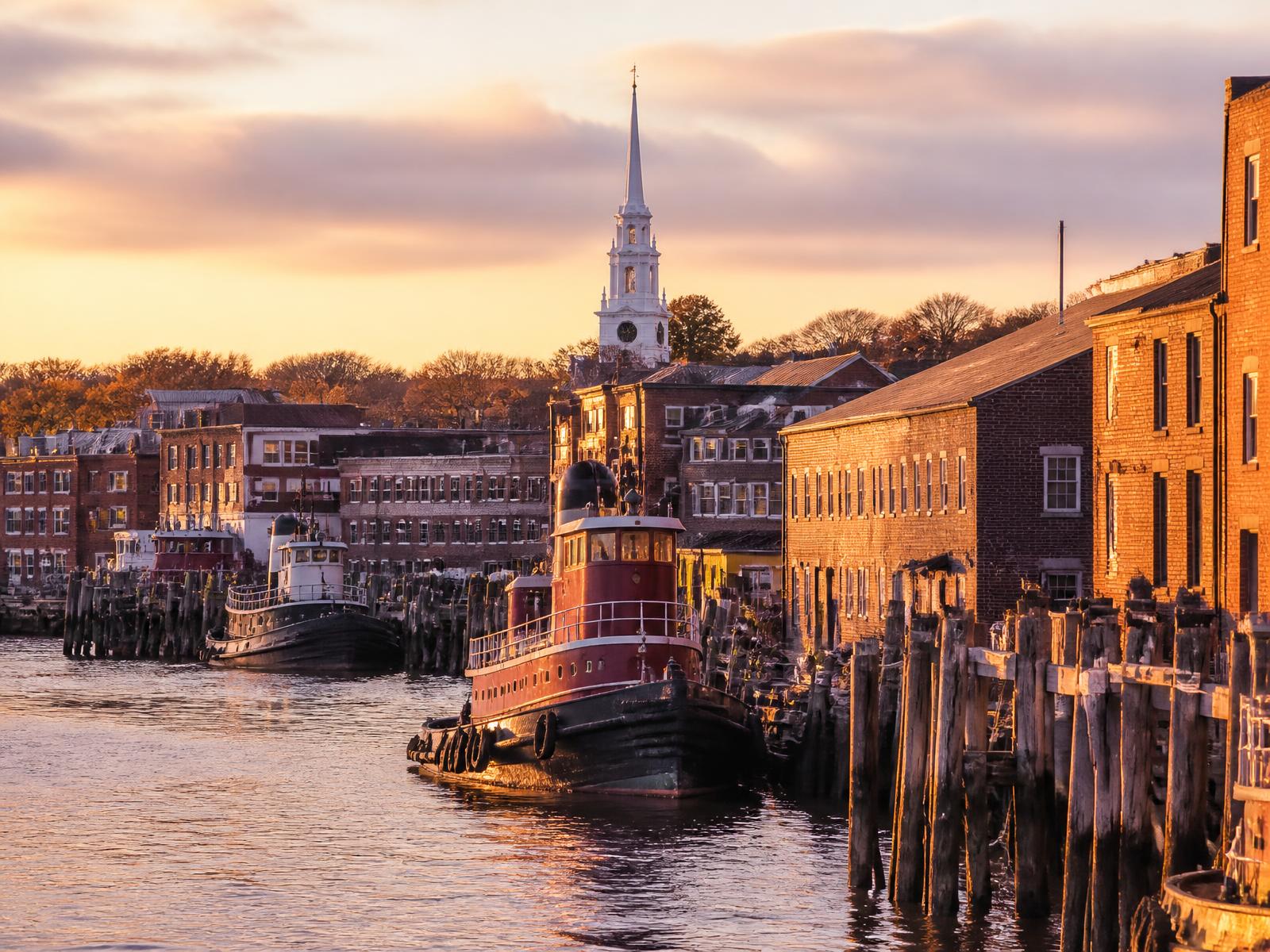 A warm-toned view of the Portsmouth waterfront along the Piscataqua River.
